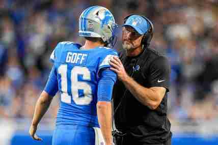 Detroit Lions quarterback Jared Goff (16) talks to head coach Dan Campbell at a timeout against Los Angeles Rams during the first half at Ford Field in Detroit on Sunday, September 8, 2024.