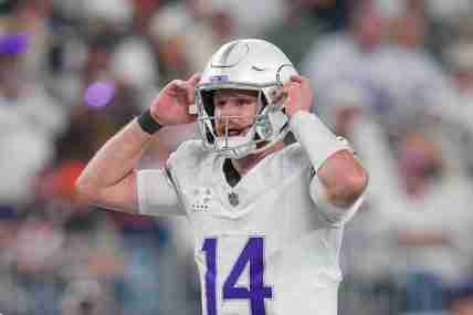 Dec 16, 2024; Minneapolis, Minnesota, USA; Minnesota Vikings quarterback Sam Darnold (14) at the line of scrimmage against the Chicago Bears in the third quarter at U.S. Bank Stadium. Mandatory Credit: Brad Rempel-Imagn Images