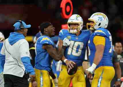 [US, Mexico & Canada customers only] Sep 5, 2025; Sao Paulo, BRAZIL; Los Angeles Chargers quarterback Justin Herbert (10) and center Bradley Bozeman (75) celebrate after the game against the Kansas City Chiefs at Corinthians Arena. Mandatory Credit: Amanda Perobelli/Reuters via Imagn Images