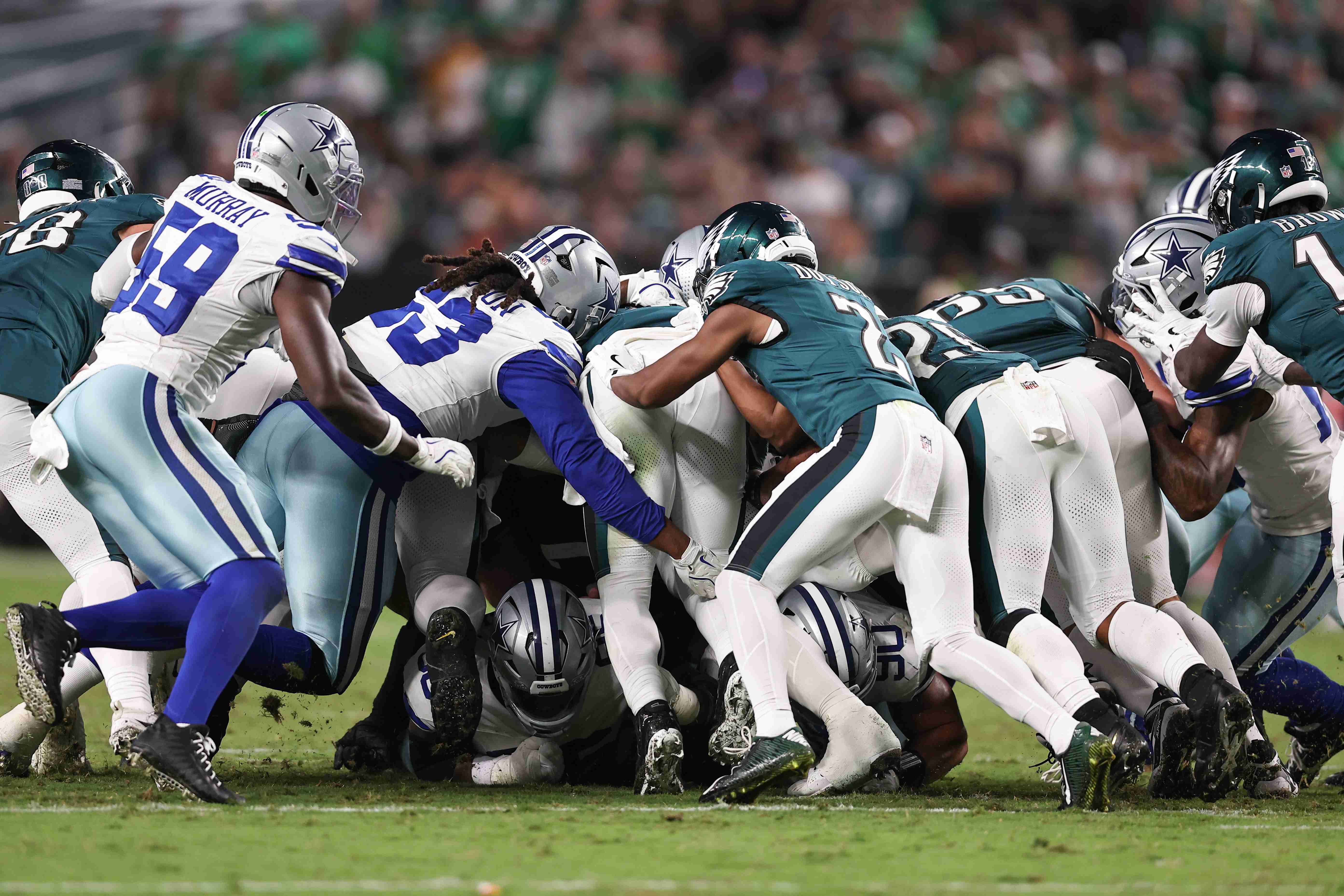 Sep 4, 2025; Philadelphia, Pennsylvania, USA; The Philadelphia Eagles execute a tush push for a first down against the Dallas Cowboys during the fourth quarter of the game at Lincoln Financial Field. Mandatory Credit: Bill Streicher-Imagn Images