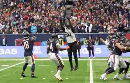 Oct 13, 2024; London, United Kingdom; Chicago Bears quarterback Caleb Williams (18) throws a pass for a touchdown in the end zone during the second half of an NFL International Series game at Tottenham Hotspur Stadium. Mandatory Credit: Peter van den Berg-Imagn Images